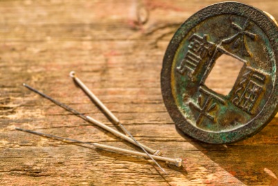 acupuncture needles with antique chinese coin